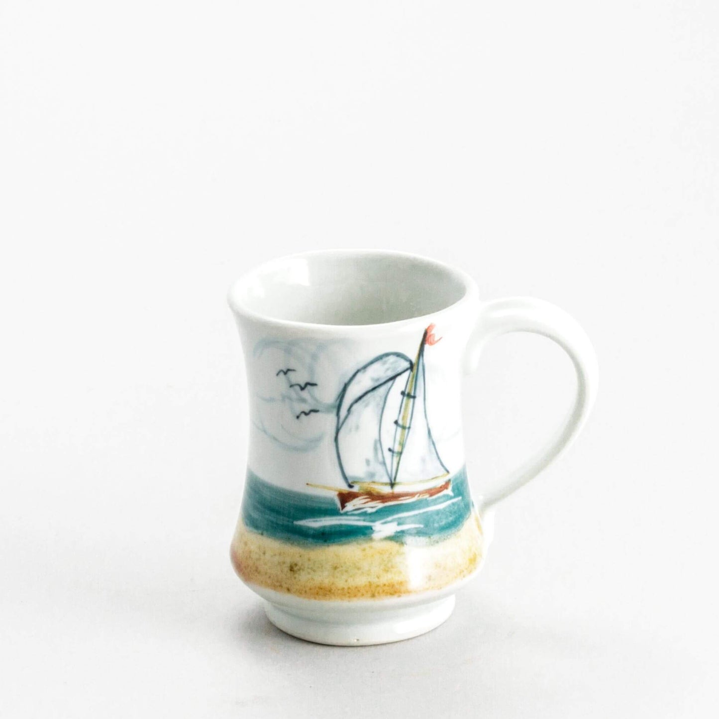 Handmade Pottery Pedestal Mug made by Georgetown Pottery in Maine Sailboat