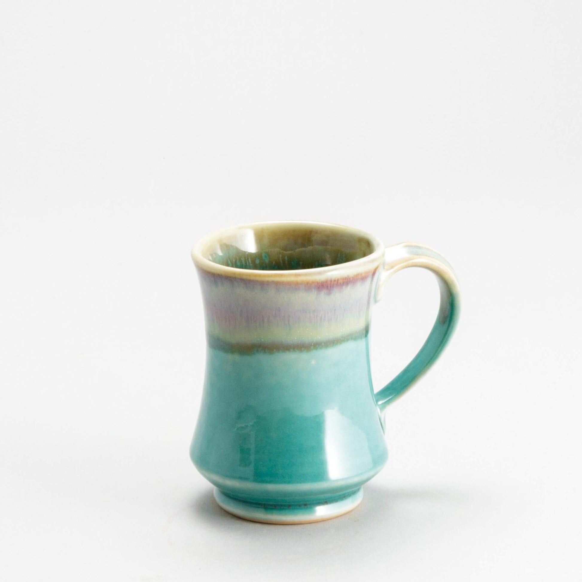 Handmade Pottery Pedestal Mug made by Georgetown Pottery in Maine Green Oribe