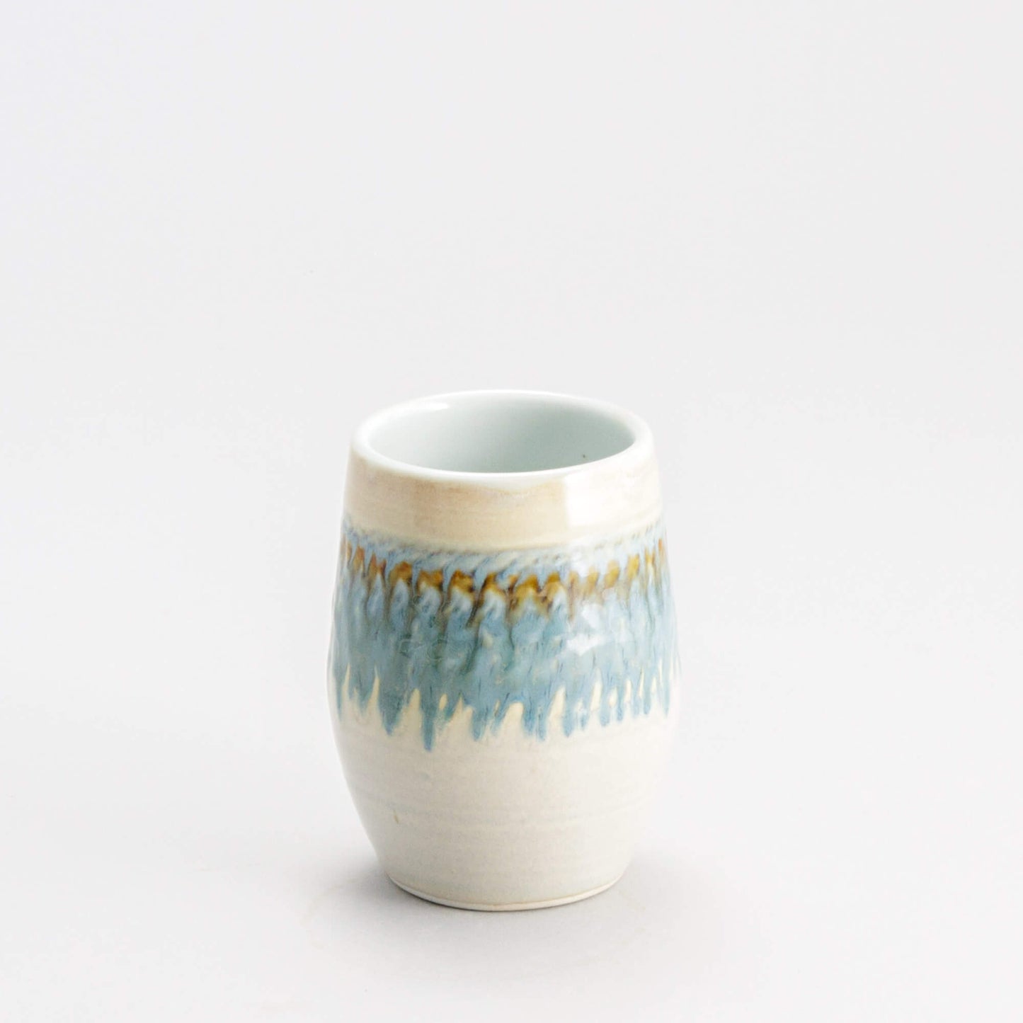 Handmade Pottery Stemless Wine Tumbler made by Georgetown Pottery in Maine Ivory & Blue Oribe