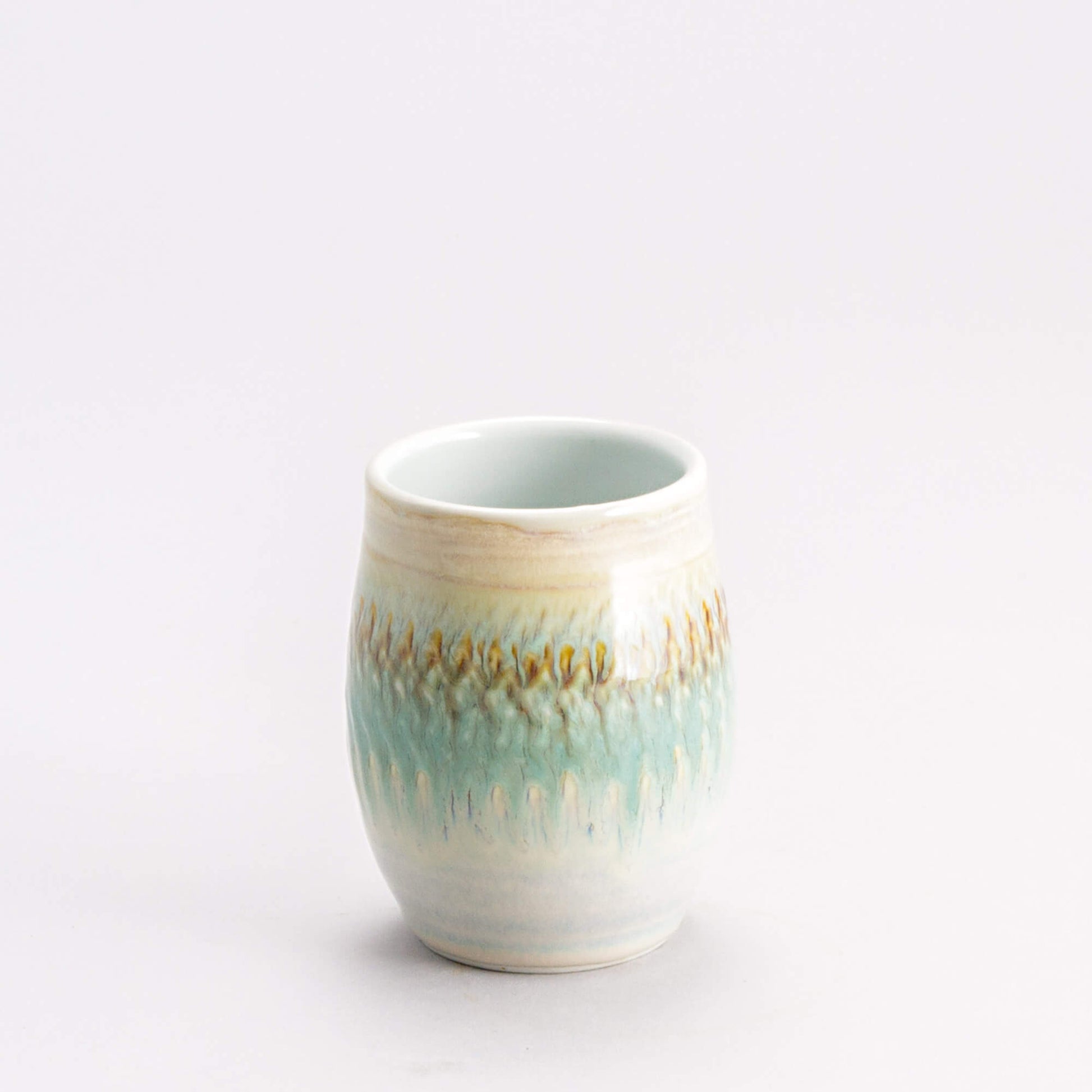 Handmade Pottery Stemless Wine Tumbler made by Georgetown Pottery in Maine Ivory & Green Oribe