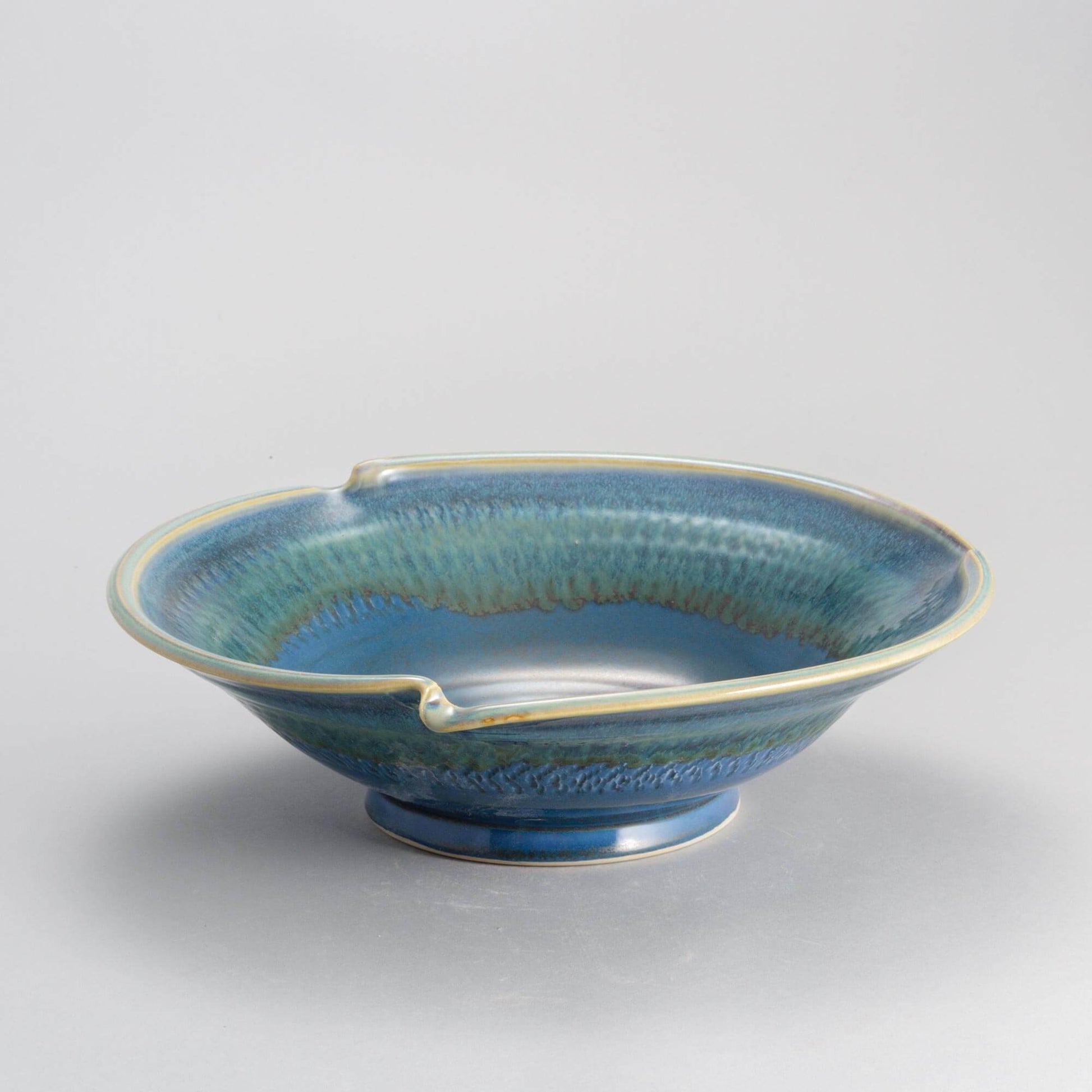 Handmade Pottery Signature Wave Bowl in Blue Oribe pattern made by Georgetown Pottery in Maine