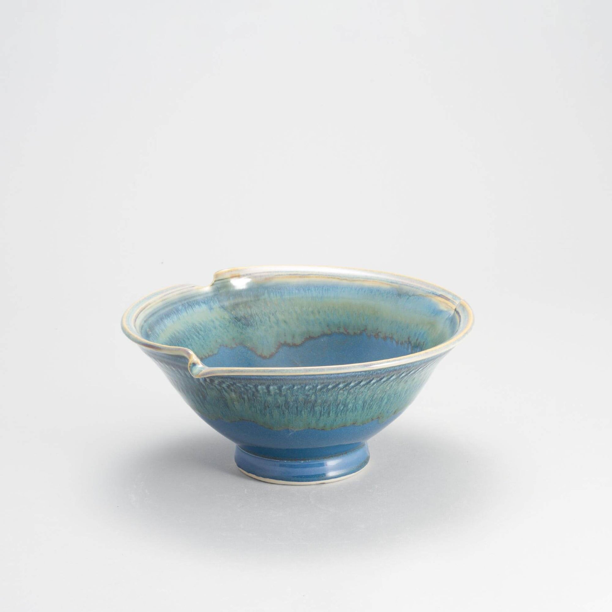 Handmade Pottery Signature Wave Bowl in Blue Oribe pattern made by Georgetown Pottery in Maine