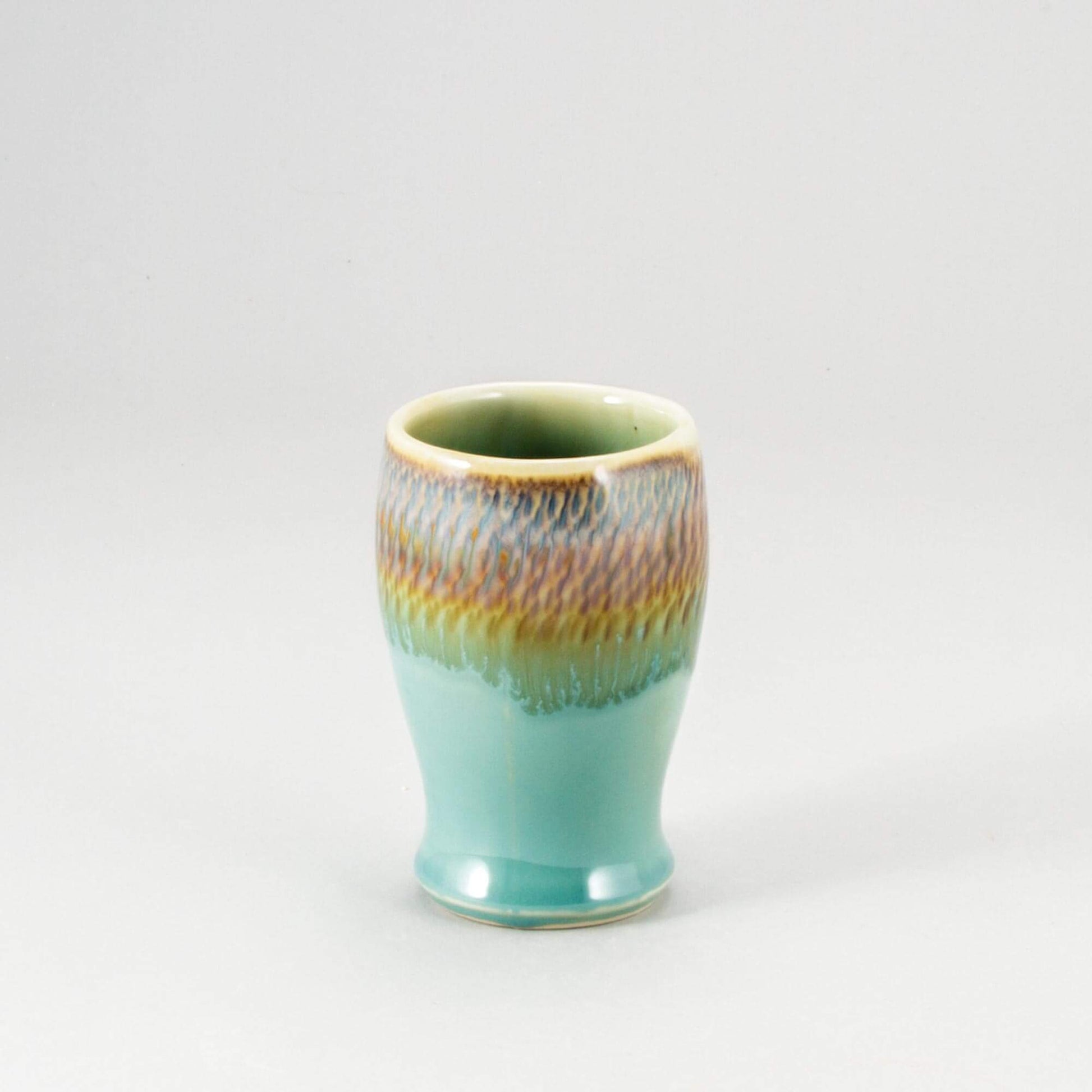 andmade Pottery Curvy Tumbler in Green Oribe pattern made by Georgetown Pottery in Maine