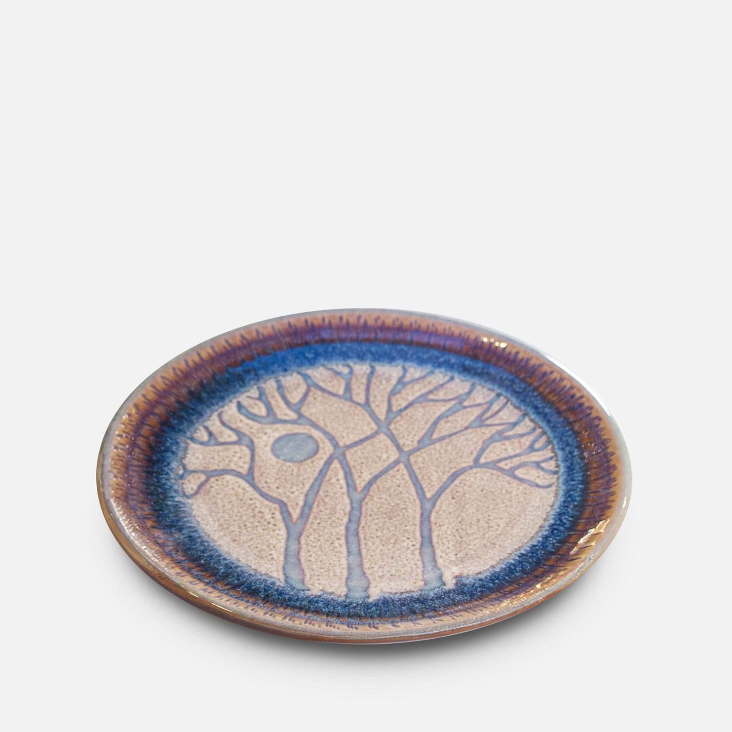 Handmade Pottery Rimless Dinner Plate made by Georgetown Pottery in Maine in Purple Tree pattern