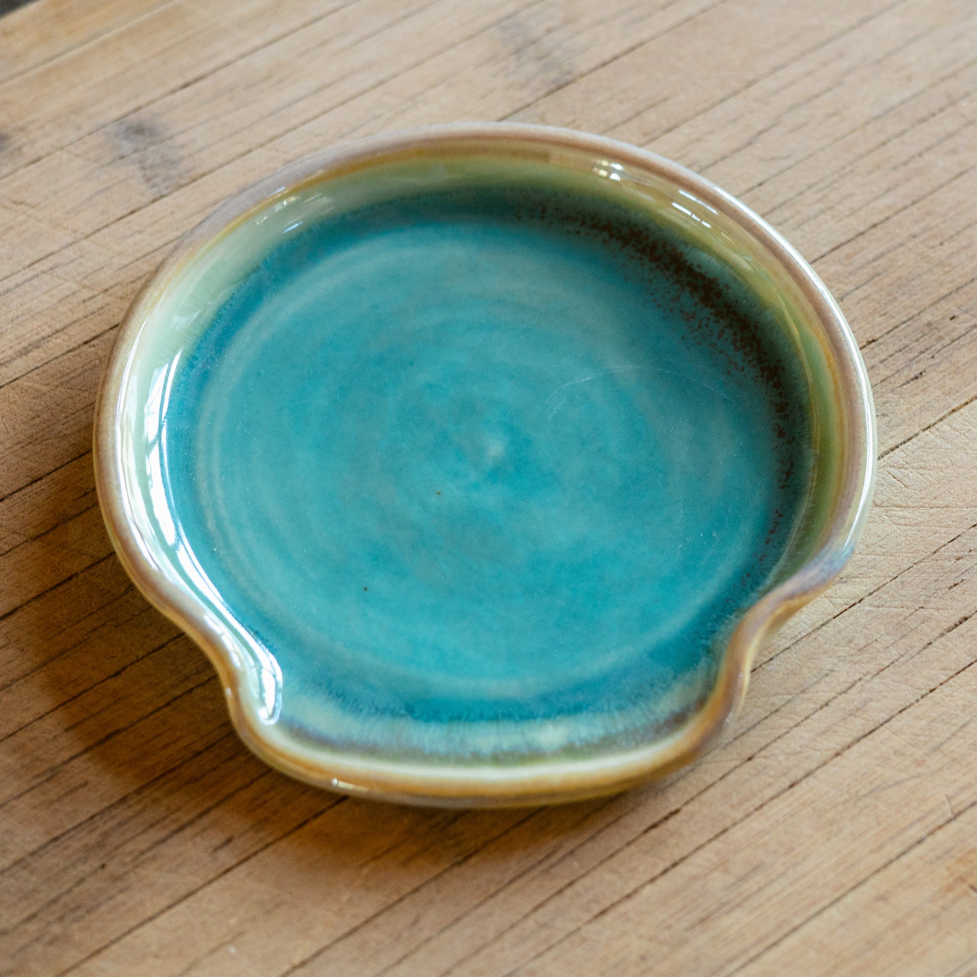 Handmade ceramic Spoon Rest in Green Oribe made by Georgetown Pottery in Maine