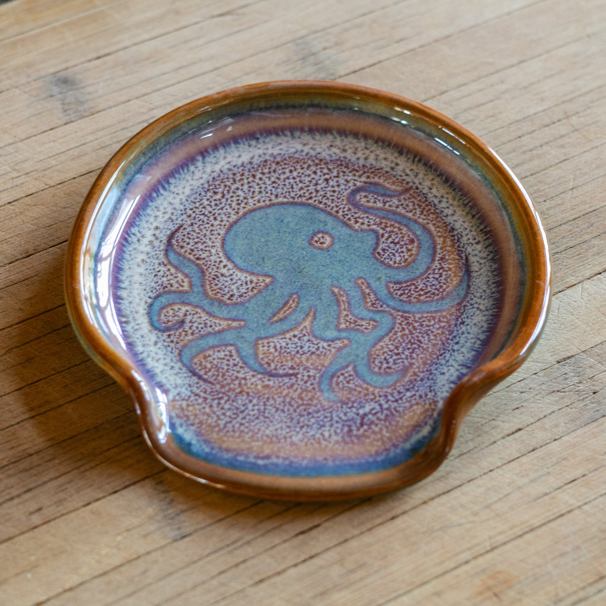 Handmade ceramic Spoon Rest in Purple Octopus pattern made by Georgetown Pottery in Maine